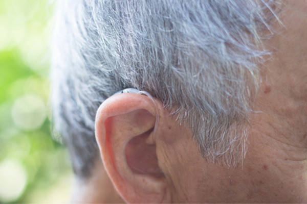 Man wearing a nearly invisible hearing aid