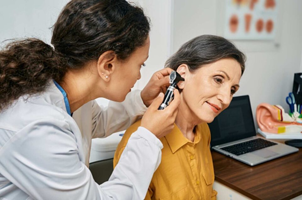 A women is getting her ears treated in Naples & Estero, FL
