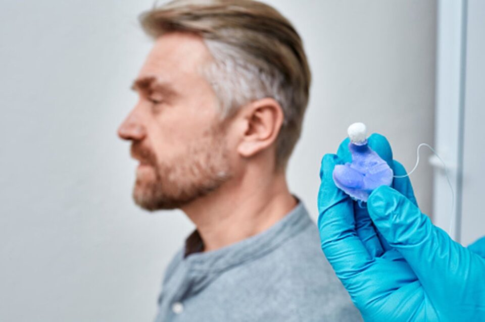 A man is seen getting an earmold in Naples & Estero, FL